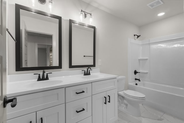 full bathroom with shower / bathing tub combination, vanity, and toilet