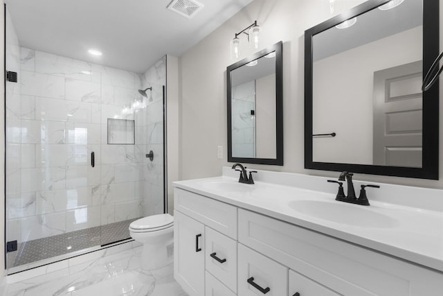 bathroom featuring vanity, toilet, and an enclosed shower