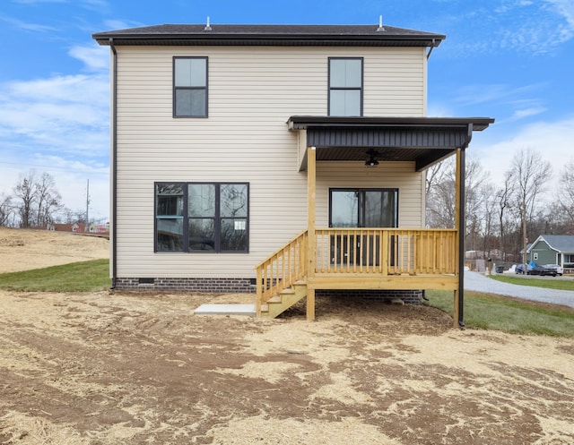 back of house with ceiling fan