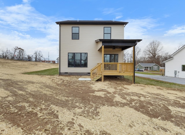 back of property with a porch