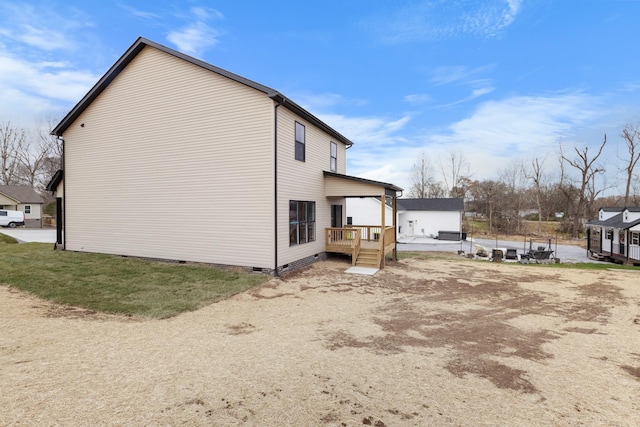 view of side of property with a deck