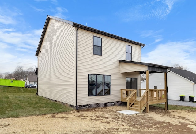 back of house with a yard and a deck