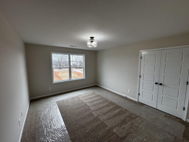 unfurnished room featuring carpet floors