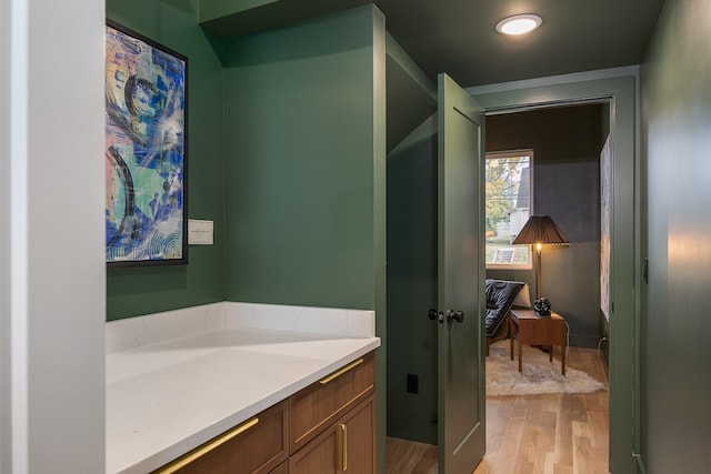 bathroom featuring vanity and hardwood / wood-style flooring