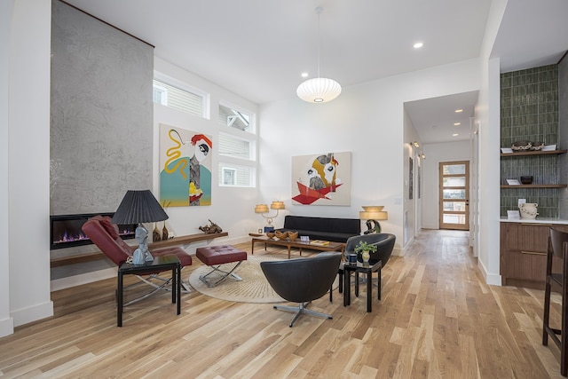 interior space with a fireplace and light wood-type flooring