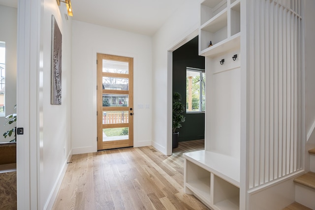 mudroom with light hardwood / wood-style flooring