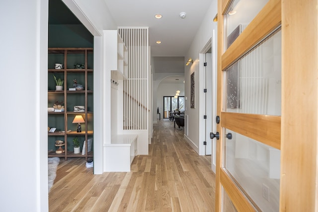 hall with light hardwood / wood-style flooring