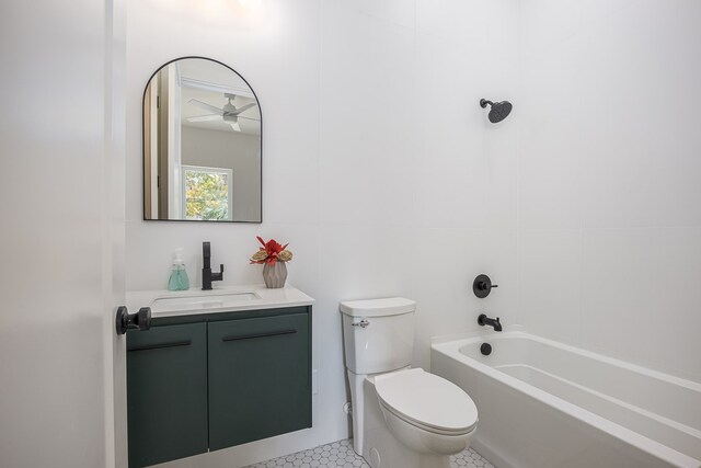 full bathroom featuring ceiling fan, vanity, shower / bathtub combination, and toilet