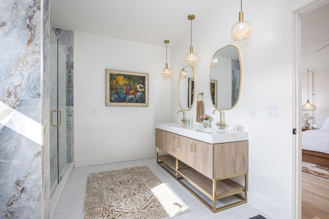 bathroom with hardwood / wood-style floors, vanity, and walk in shower