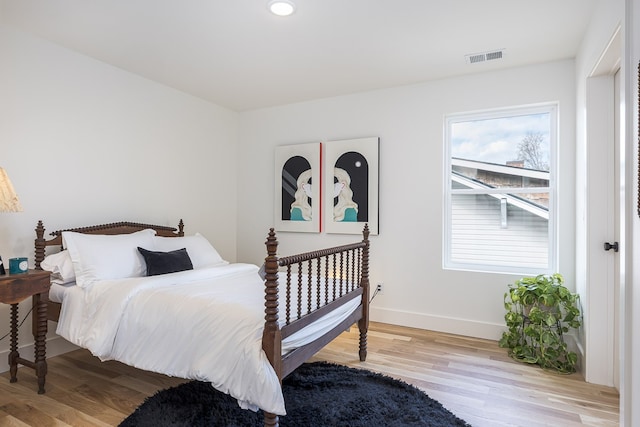 bedroom with light hardwood / wood-style floors