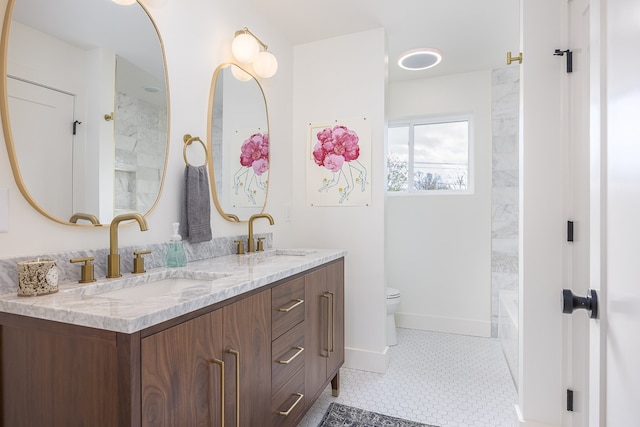 full bathroom with tile patterned flooring, vanity, toilet, and tiled shower / bath