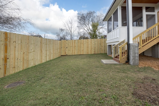 view of yard featuring a sunroom