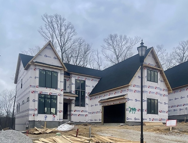 property in mid-construction with an attached garage