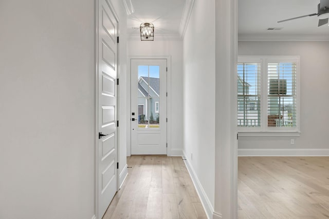 doorway to outside featuring ornamental molding, ceiling fan, and light hardwood / wood-style floors