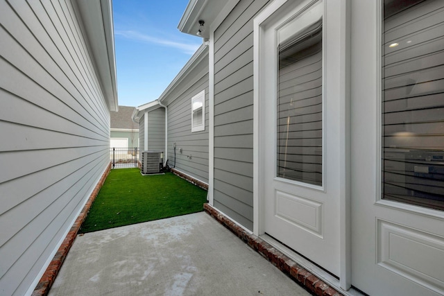 view of yard featuring a patio and central air condition unit