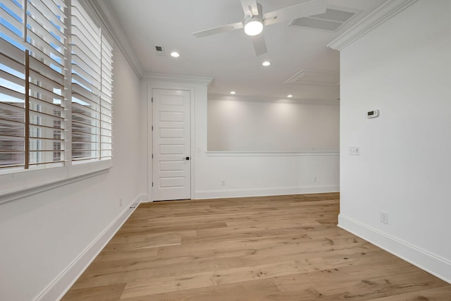 unfurnished room with crown molding, ceiling fan, and light hardwood / wood-style flooring