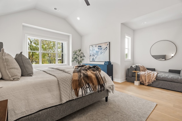 bedroom with lofted ceiling, wood-type flooring, and ceiling fan