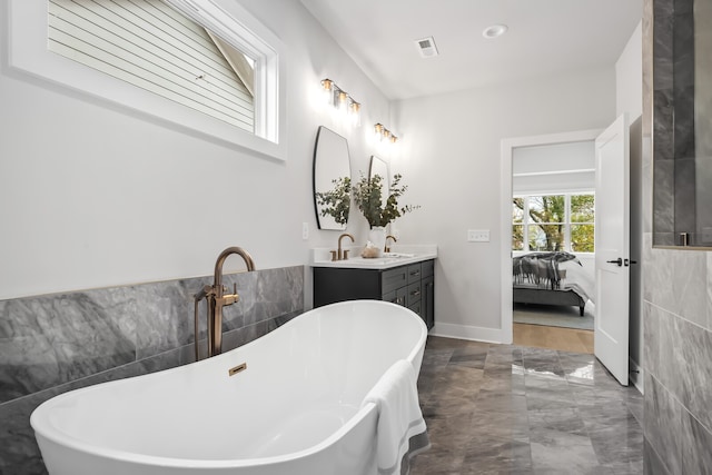 bathroom featuring vanity and a bathtub