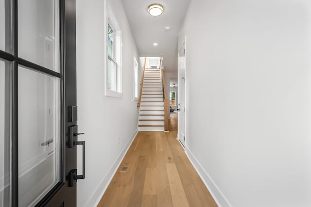 hall with light wood-type flooring