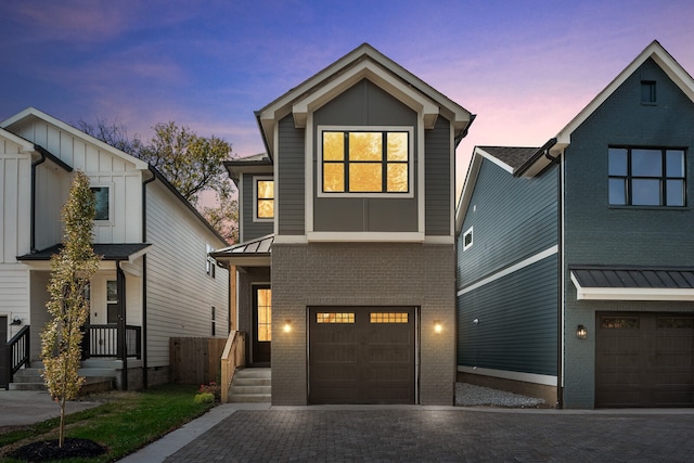 view of front of property with a garage