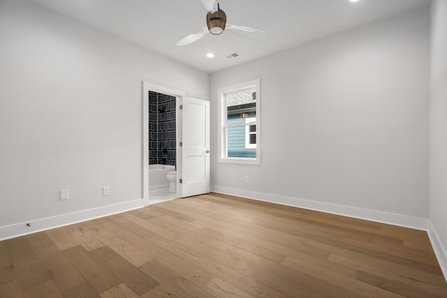 unfurnished room with light wood-type flooring and ceiling fan