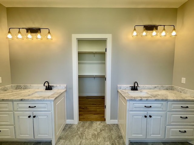 bathroom with vanity and hardwood / wood-style flooring