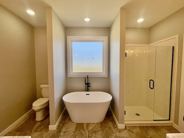 bathroom featuring toilet and shower with separate bathtub