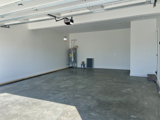 garage featuring a garage door opener and electric water heater