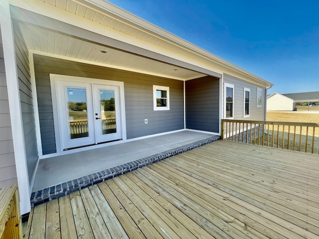 wooden terrace featuring french doors