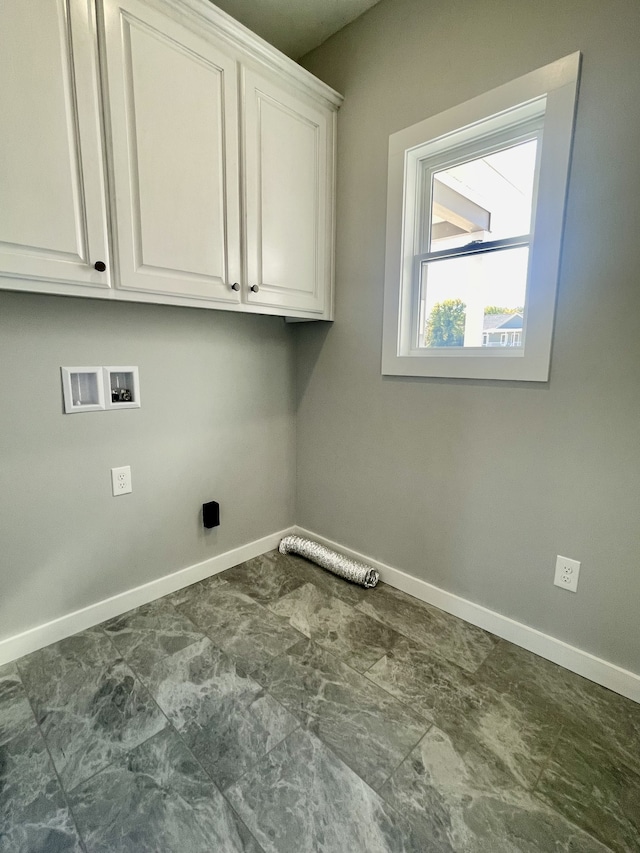 washroom with cabinets and washer hookup