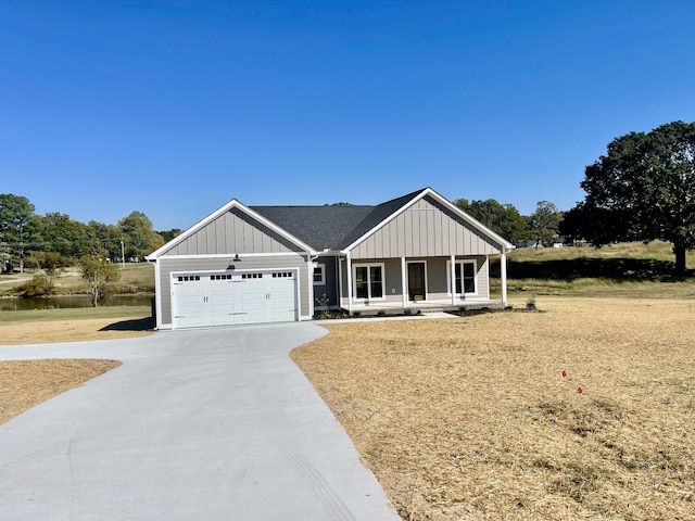 view of front of house with covered porch and a garage