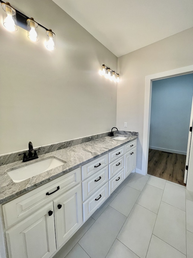 bathroom with vanity and tile patterned floors