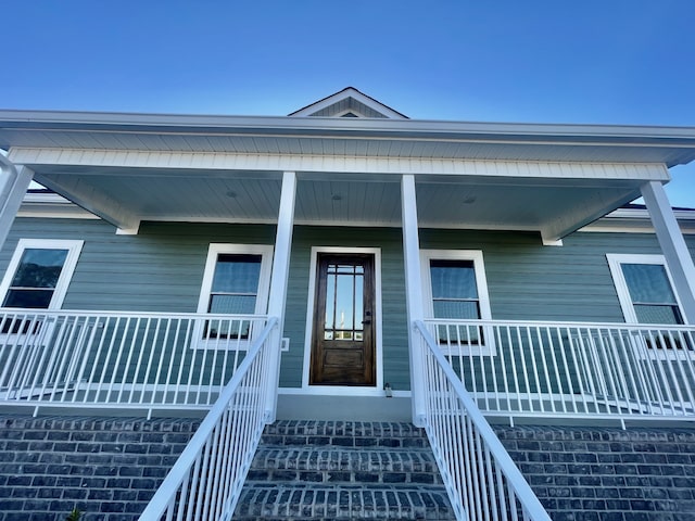 doorway to property with covered porch