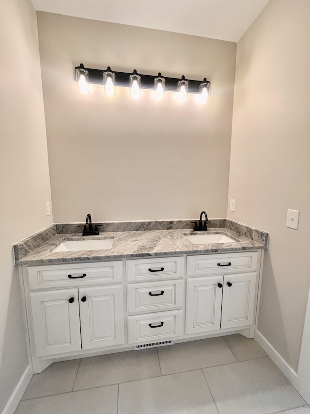 bathroom with vanity and tile patterned floors