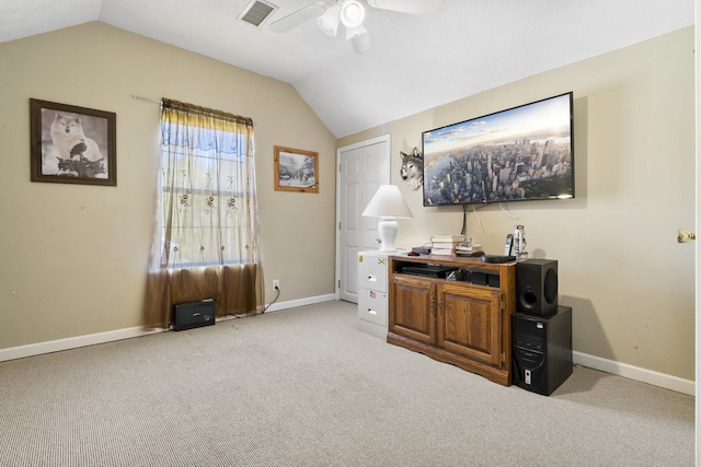 office space featuring ceiling fan, light colored carpet, and vaulted ceiling