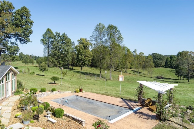 view of property's community featuring a yard and a rural view