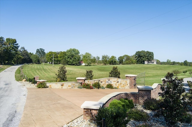 view of home's community with a lawn