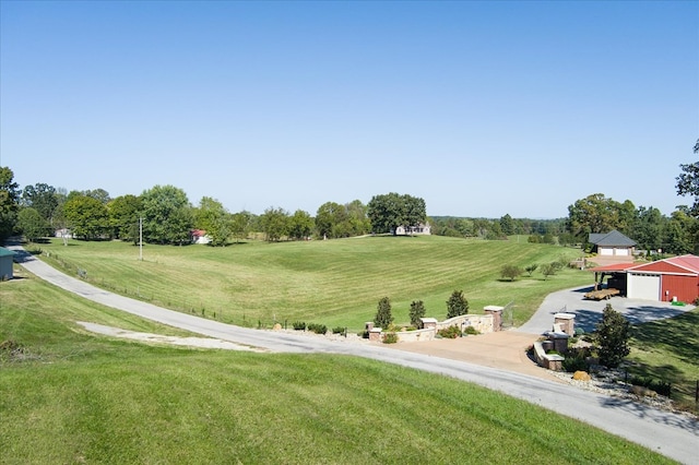 surrounding community with a yard and a garage