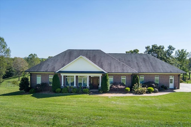 ranch-style home with a front yard