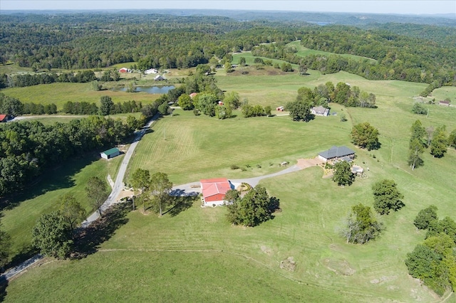 birds eye view of property featuring a water view and a rural view