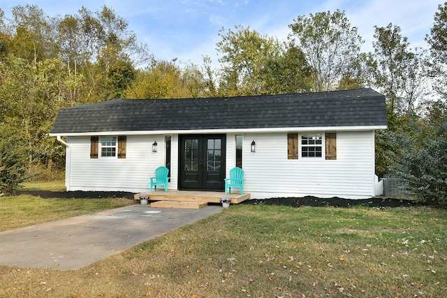 view of outbuilding featuring a yard