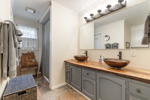 bathroom featuring vanity and ornamental molding