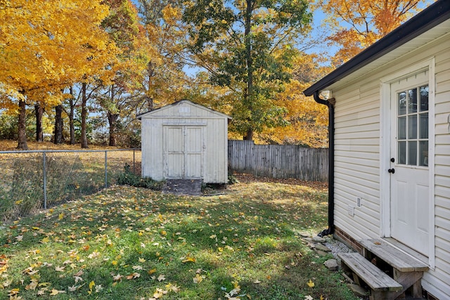 view of outbuilding with a yard