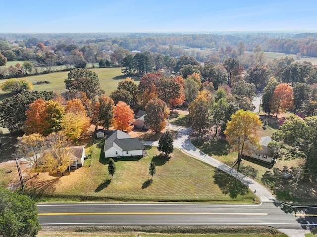 birds eye view of property with a rural view