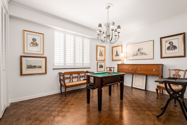 rec room with ornamental molding, a chandelier, and dark parquet flooring