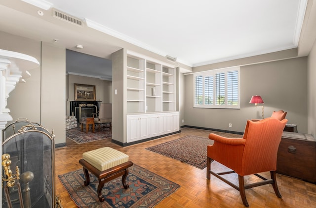 living area featuring parquet flooring and crown molding