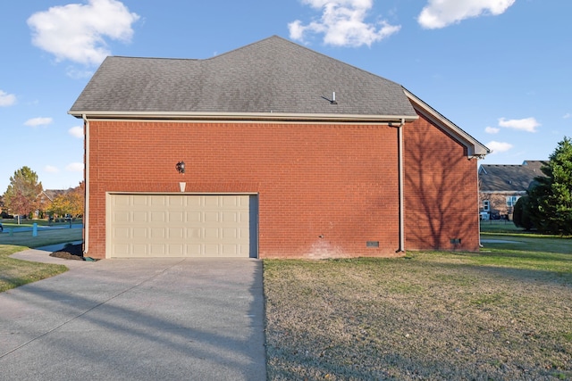 view of home's exterior with a garage and a lawn