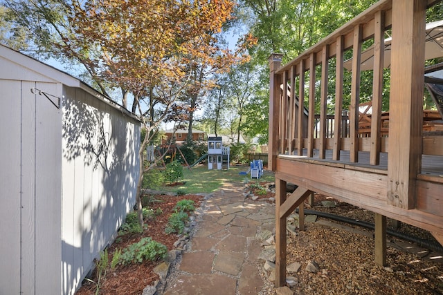 view of yard featuring a patio and a playground