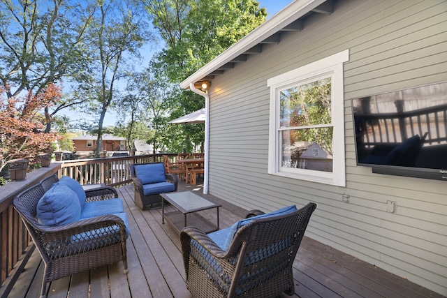 wooden terrace featuring an outdoor hangout area