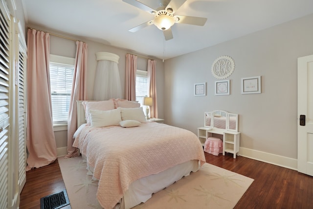 bedroom featuring dark wood-type flooring and ceiling fan